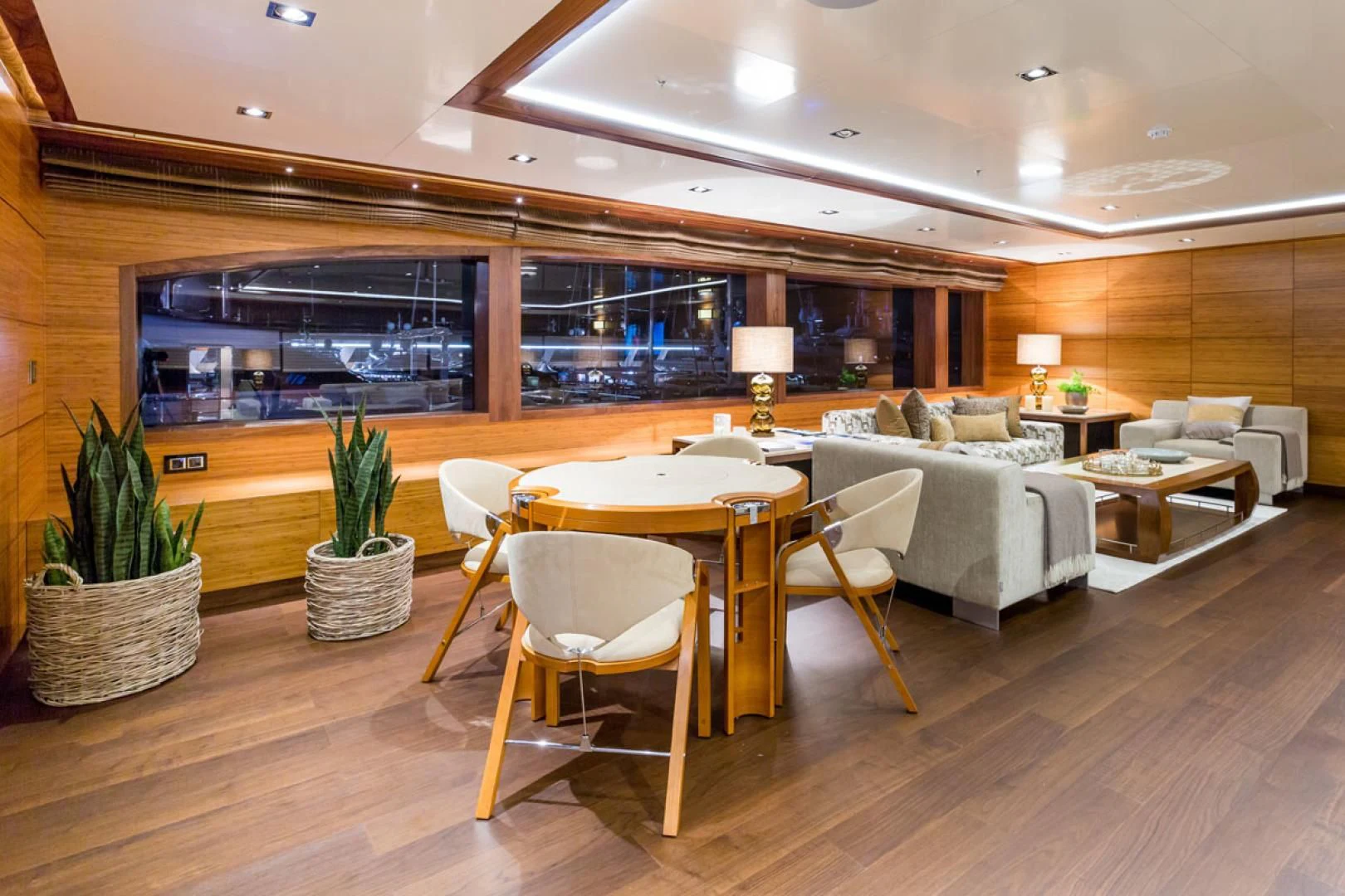 a room with a table and chairs aboard MAYBE Yacht for Sale