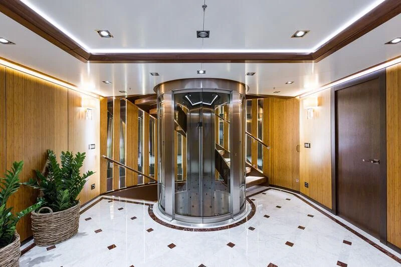 a large glass shower unit in a room with wood cabinets aboard MAYBE Yacht for Sale