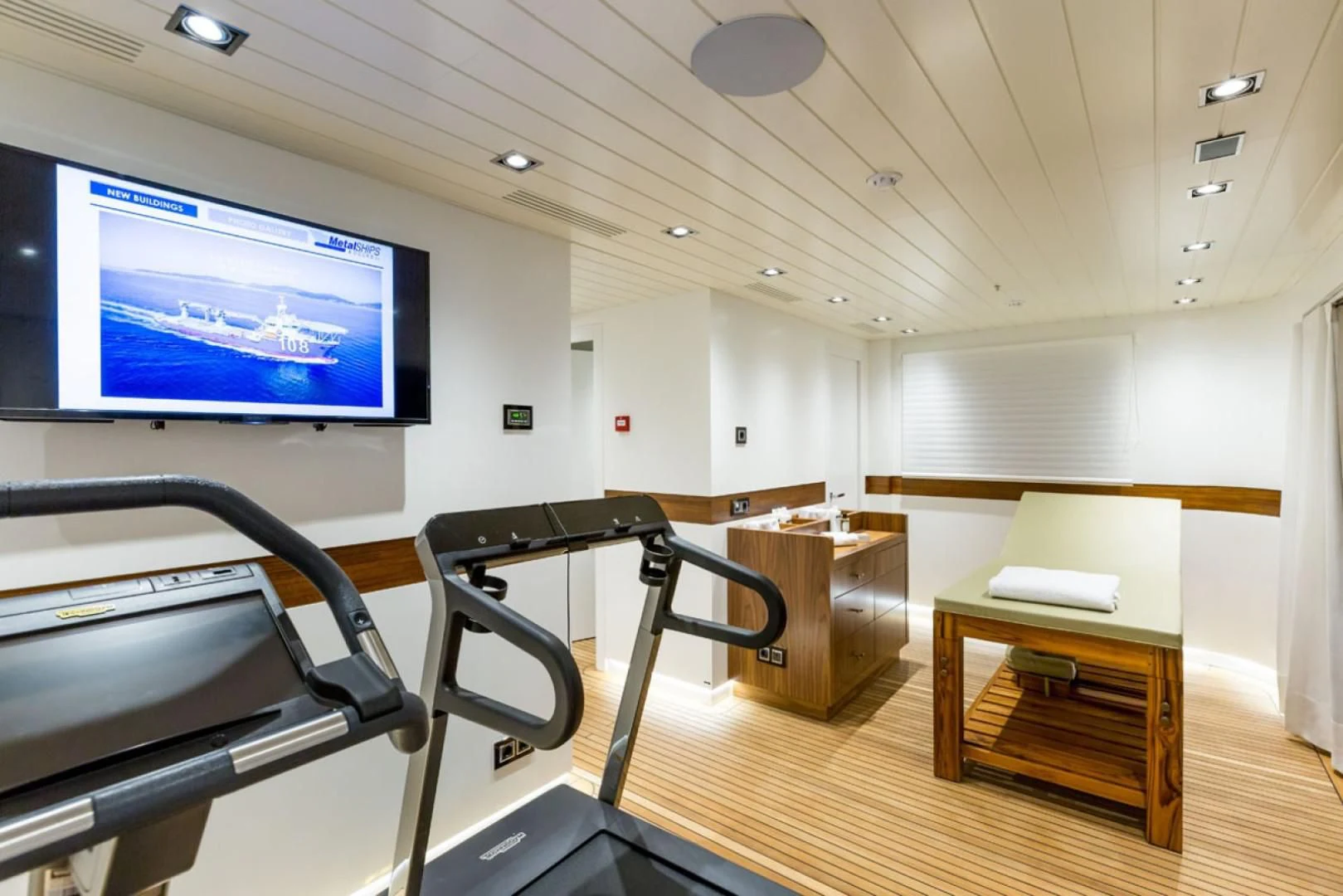 a room with a table and chairs aboard MAYBE Yacht for Sale