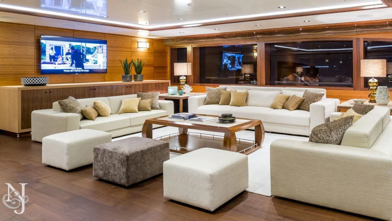 a living room with a large screen aboard MAYBE Yacht for Sale