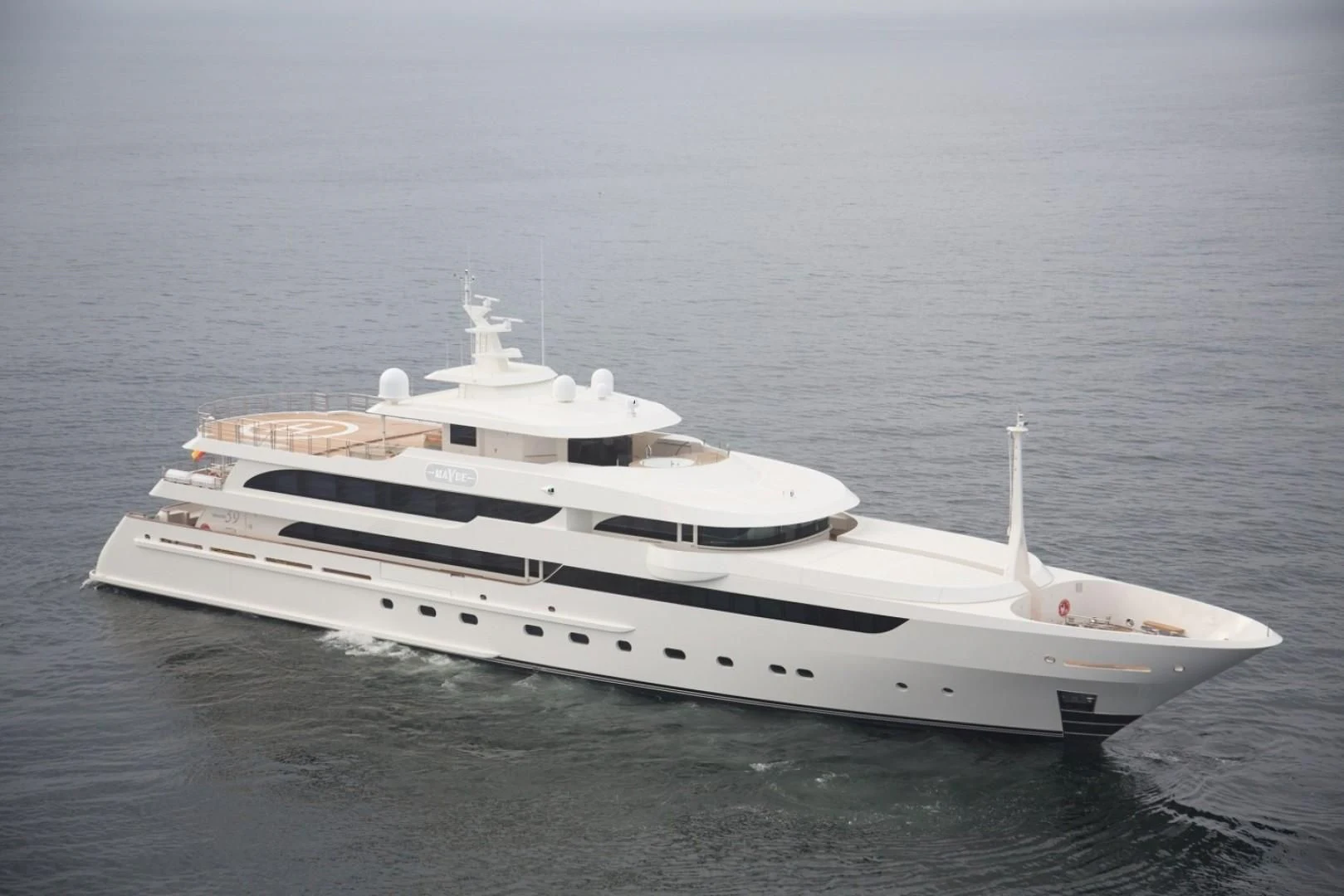 a white yacht in the water aboard MAYBE Yacht for Sale