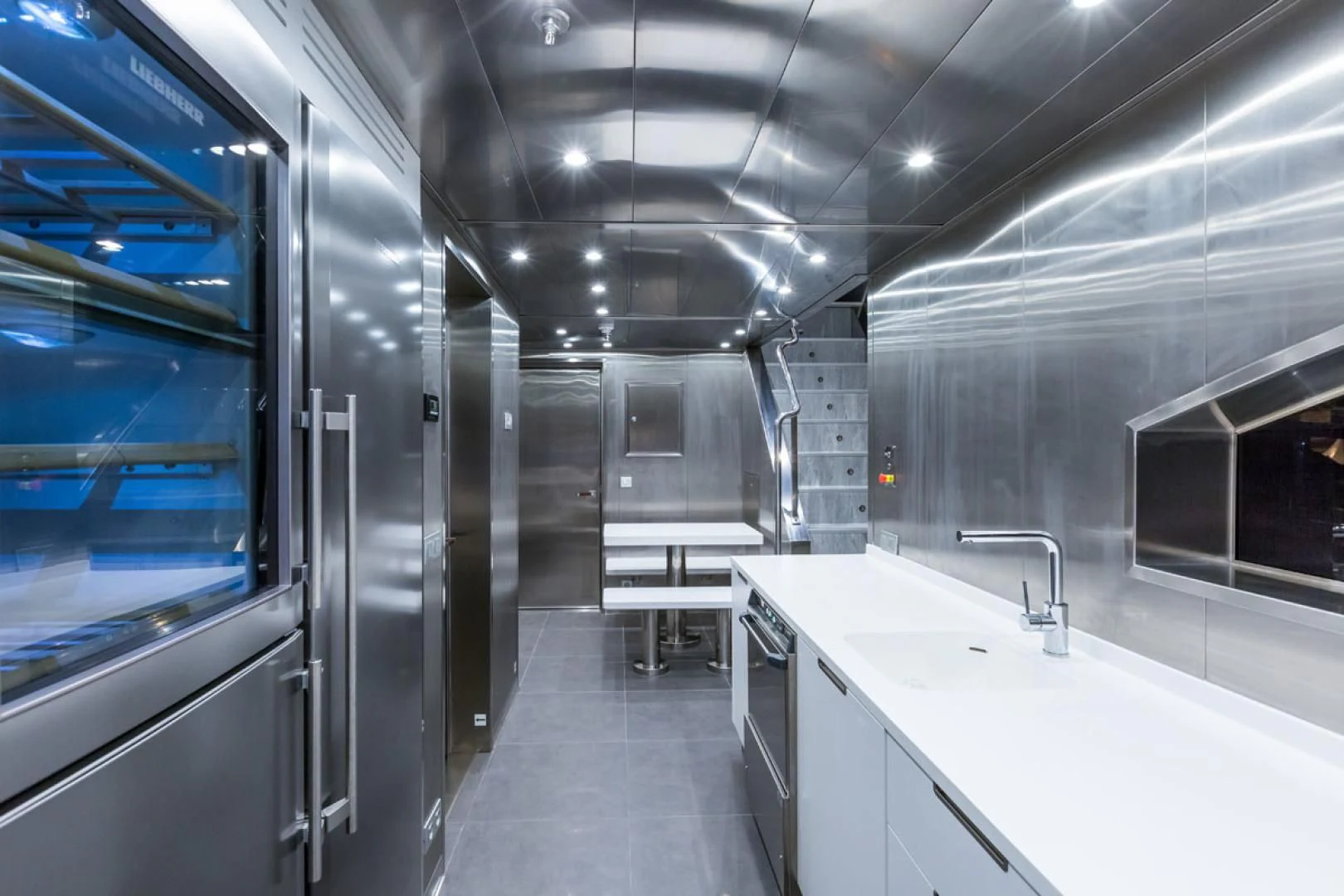 a long white kitchen aboard MAYBE Yacht for Sale