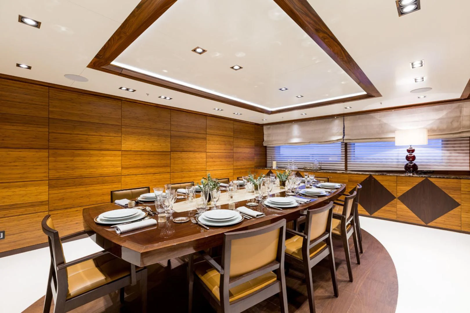 a dining table in a room aboard MAYBE Yacht for Sale