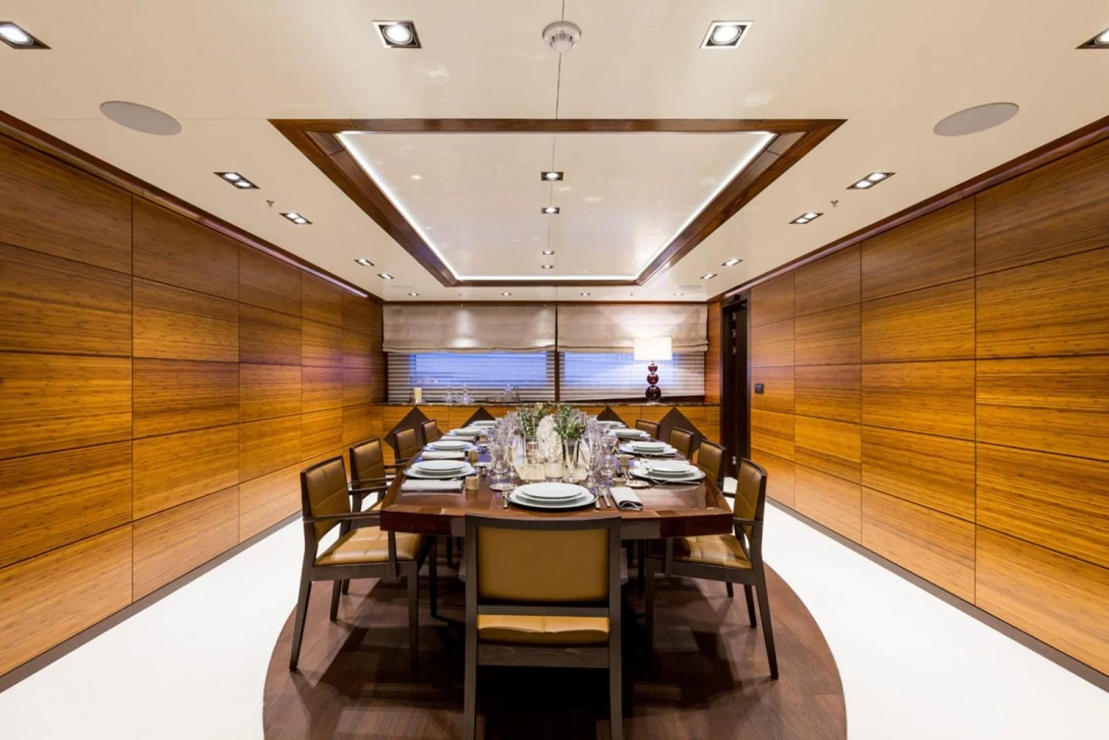 a large room with a table and chairs aboard MAYBE Yacht for Sale