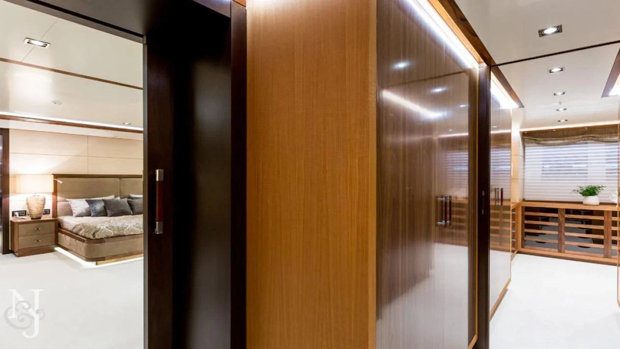 a room with a bed and a couch aboard MAYBE Yacht for Sale