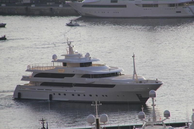 a large white boat in the water aboard MAYBE Yacht for Sale
