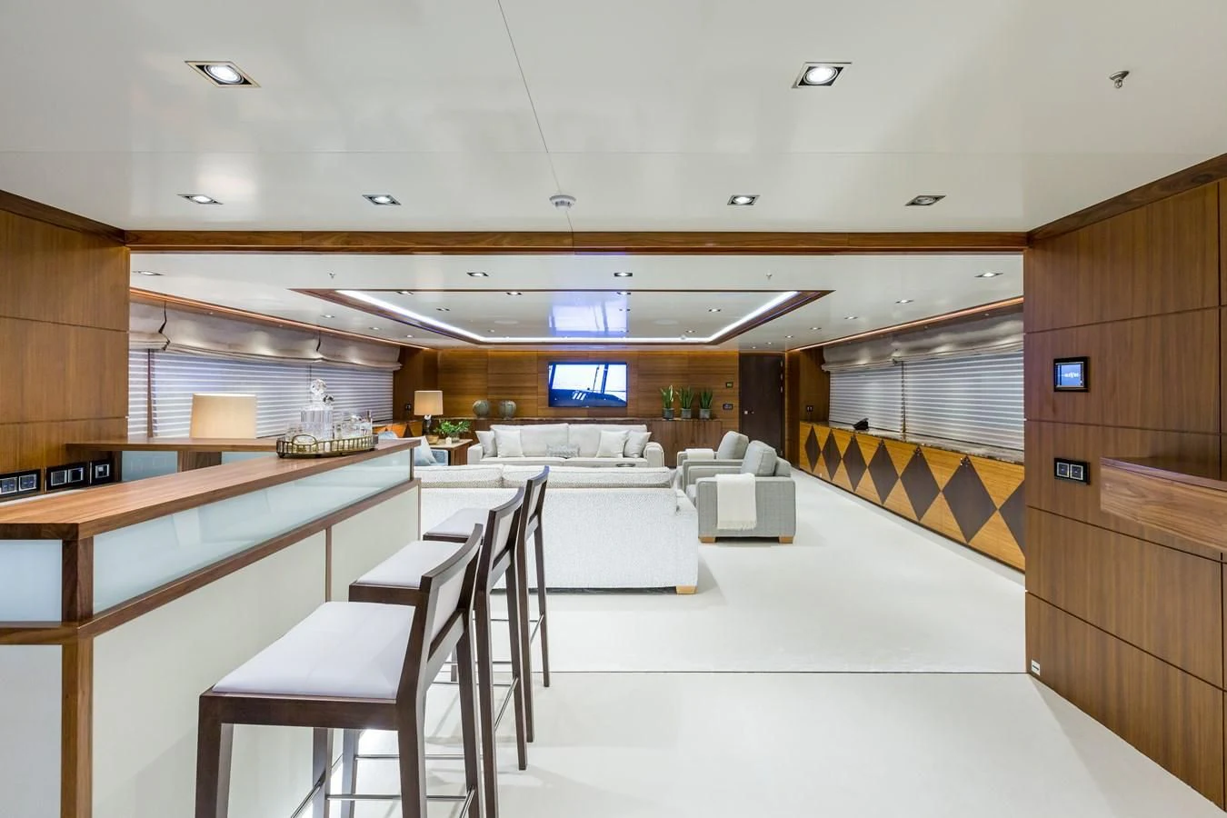 a room with a table chairs and a window aboard MAYBE Yacht for Sale