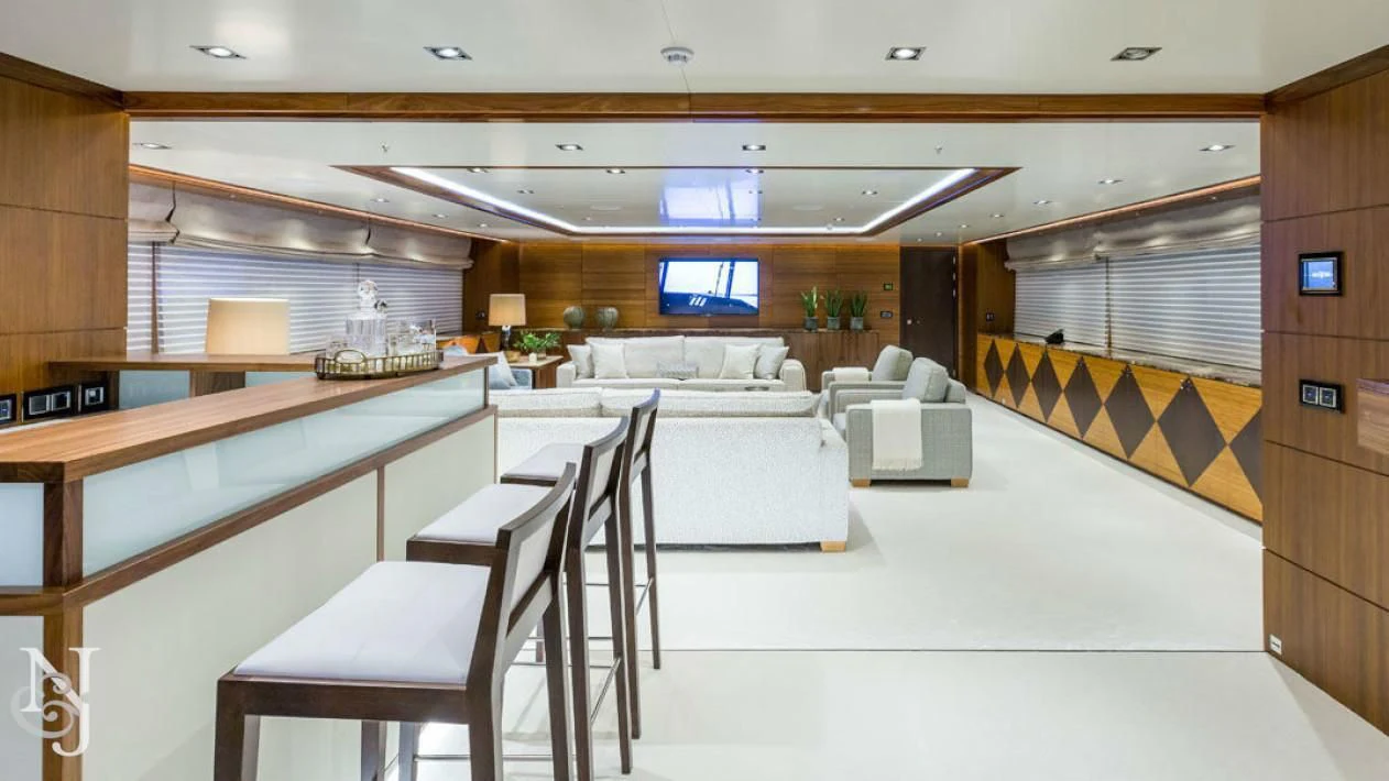 a room with a table chairs and a couch aboard MAYBE Yacht for Sale