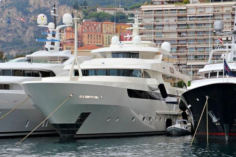 a white yacht in the water aboard MAYBE Yacht for Sale
