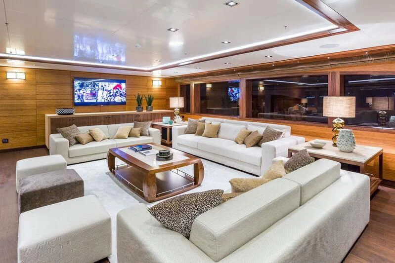 a living room with a couch and a coffee table aboard MAYBE Yacht for Sale