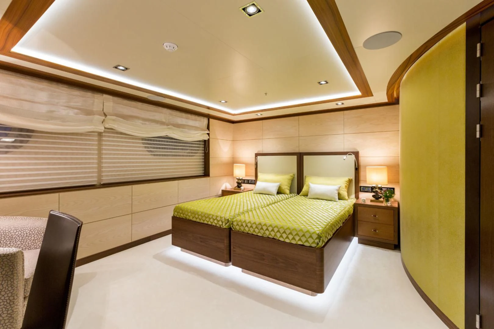 a room with a bed and a desk aboard MAYBE Yacht for Sale