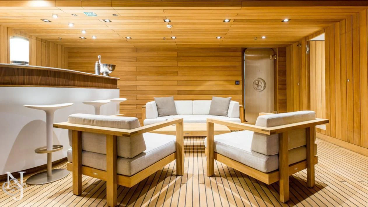 a room with a couch and a table aboard MAYBE Yacht for Sale