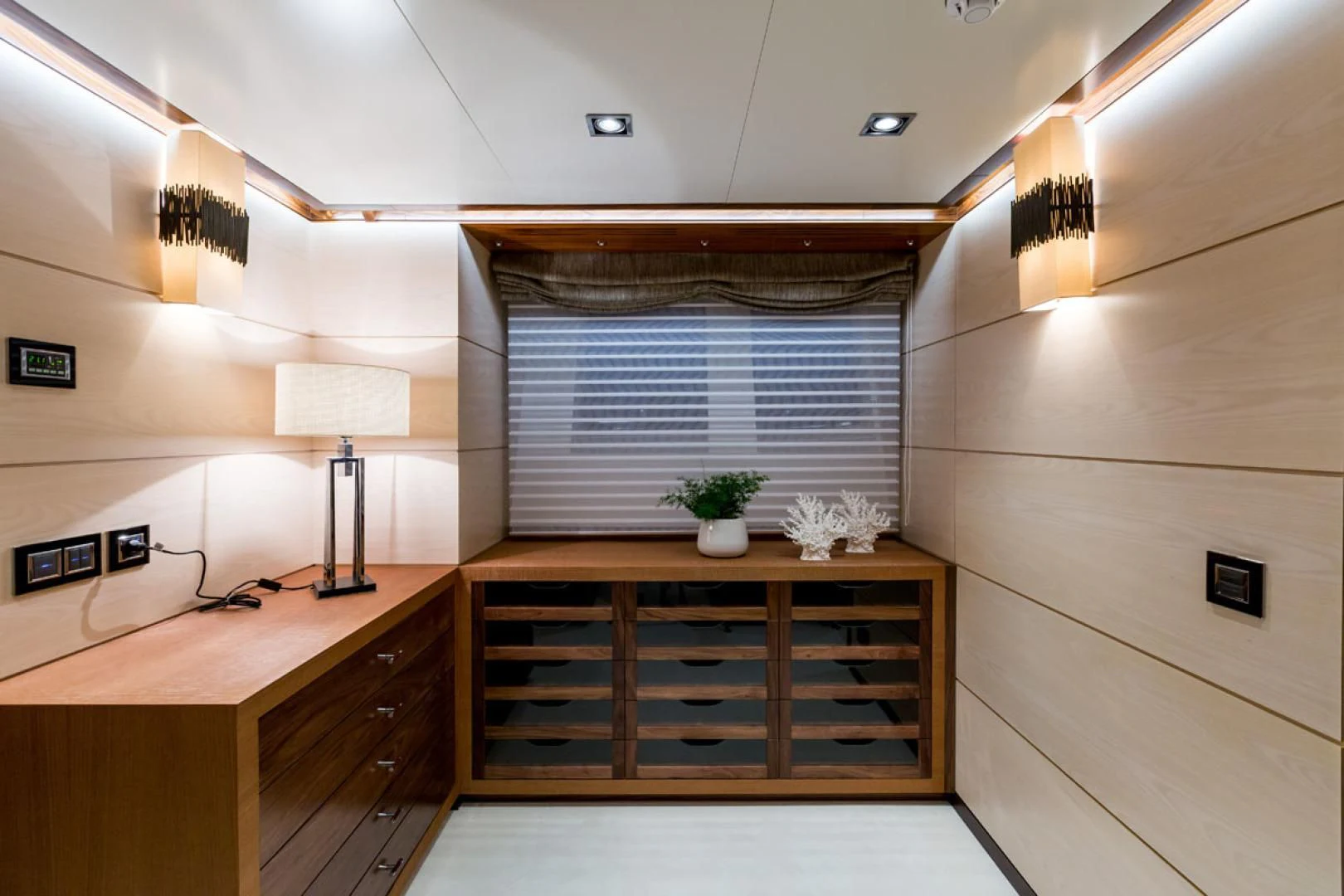 a room with a desk and a window aboard MAYBE Yacht for Sale