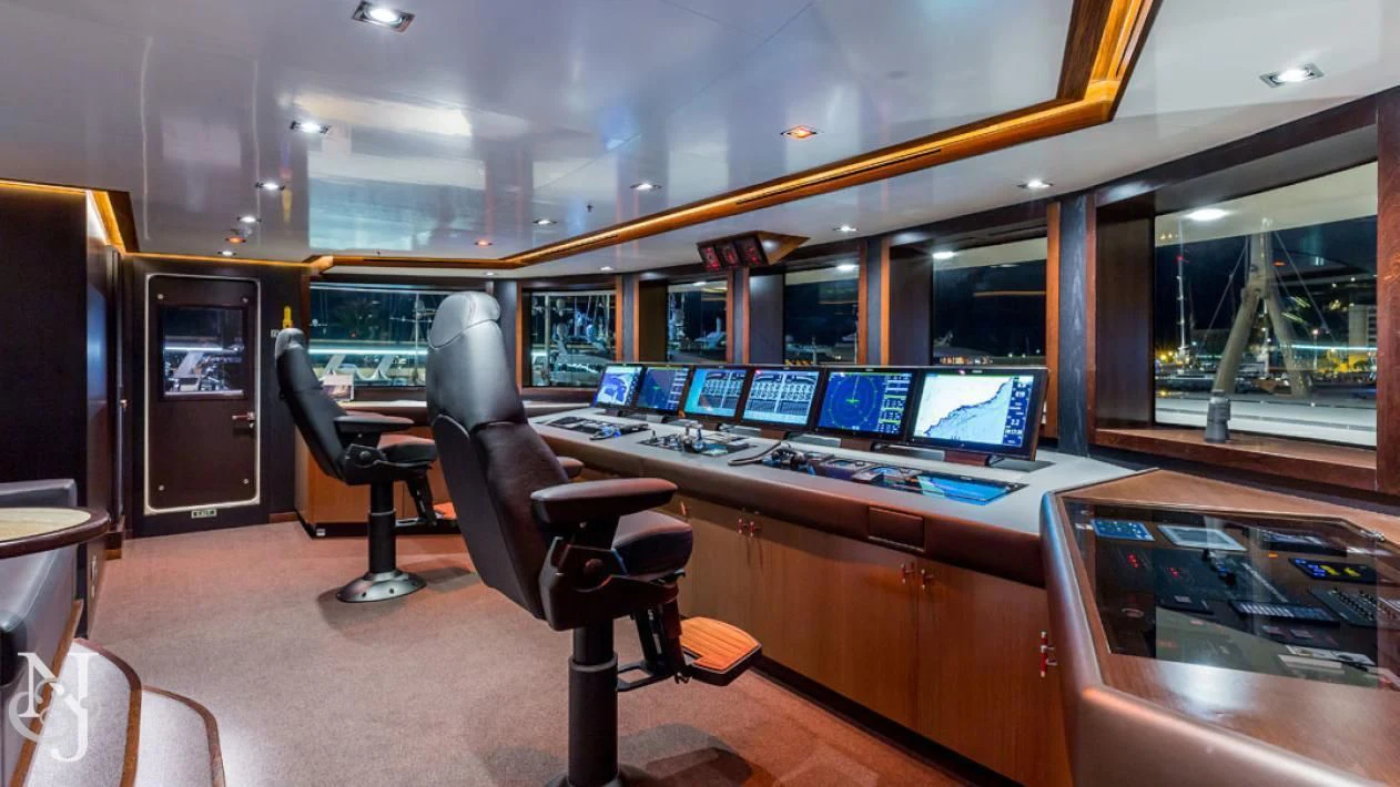 a room with a desk and chairs aboard MAYBE Yacht for Sale