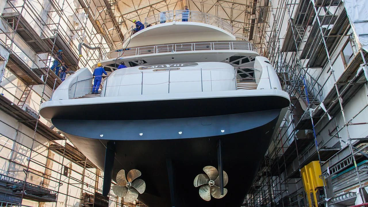 a large white ship in a large building aboard MAYBE Yacht for Sale