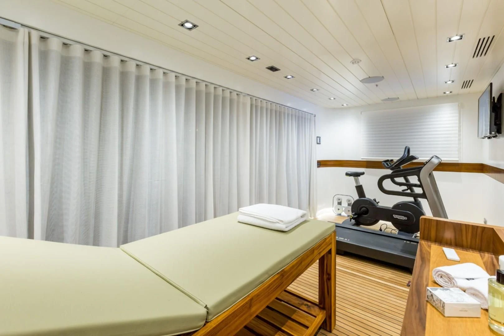 a room with a bed and a desk aboard MAYBE Yacht for Sale