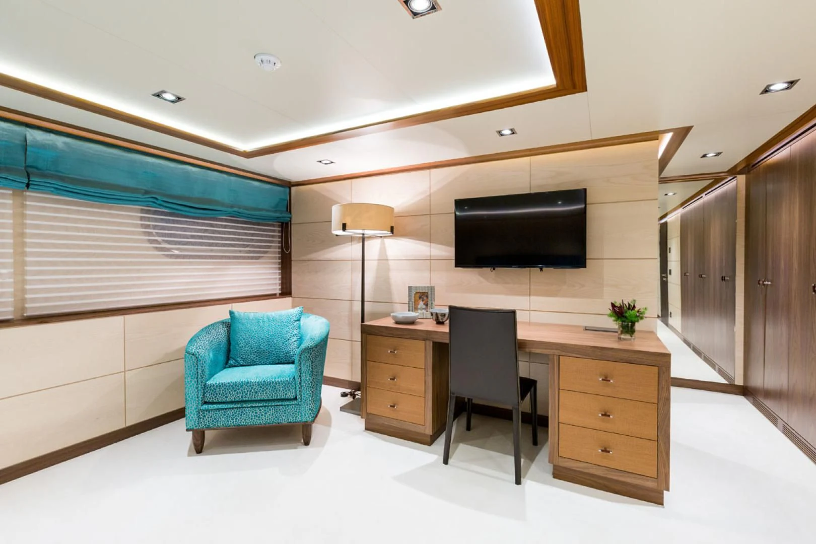 a room with a desk and a tv aboard MAYBE Yacht for Sale