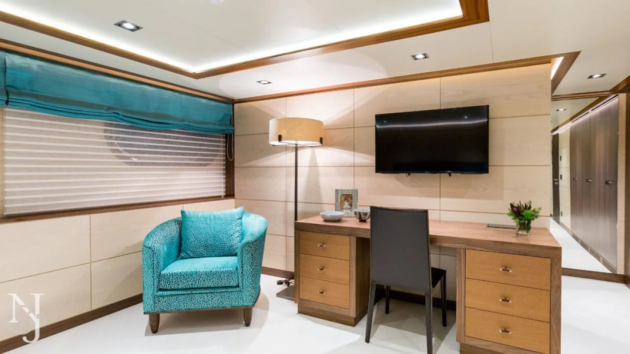 a room with a desk and a tv aboard MAYBE Yacht for Sale