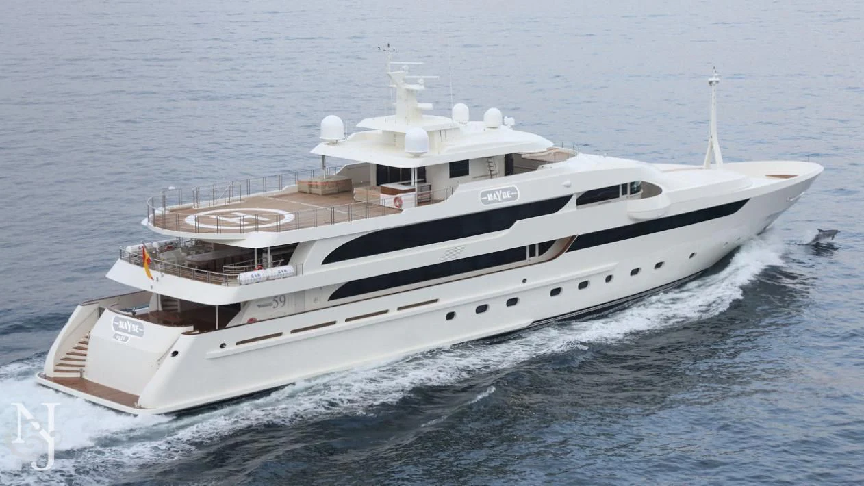 a white yacht on the water aboard MAYBE Yacht for Sale