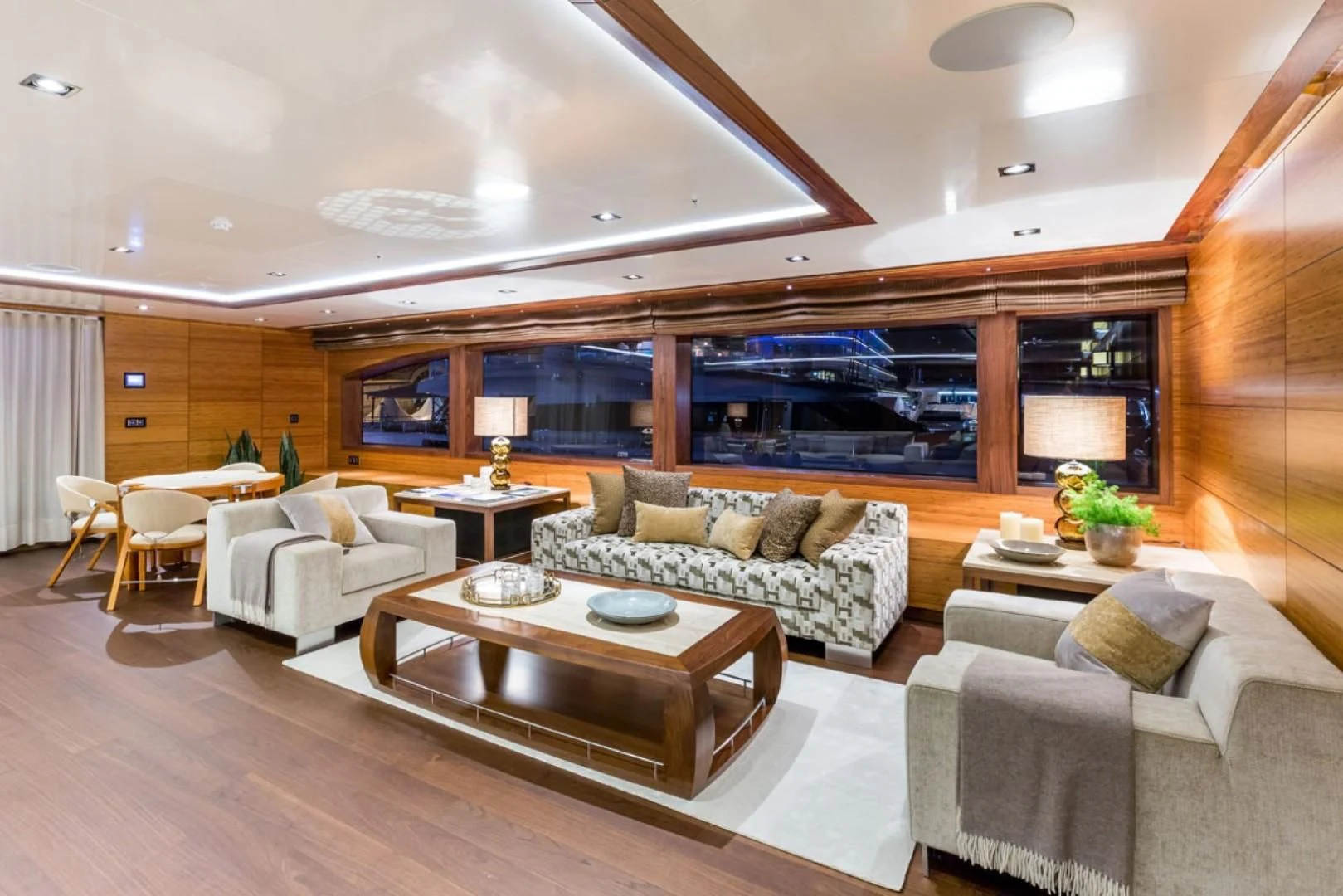 a living room with a large wood wall aboard MAYBE Yacht for Sale