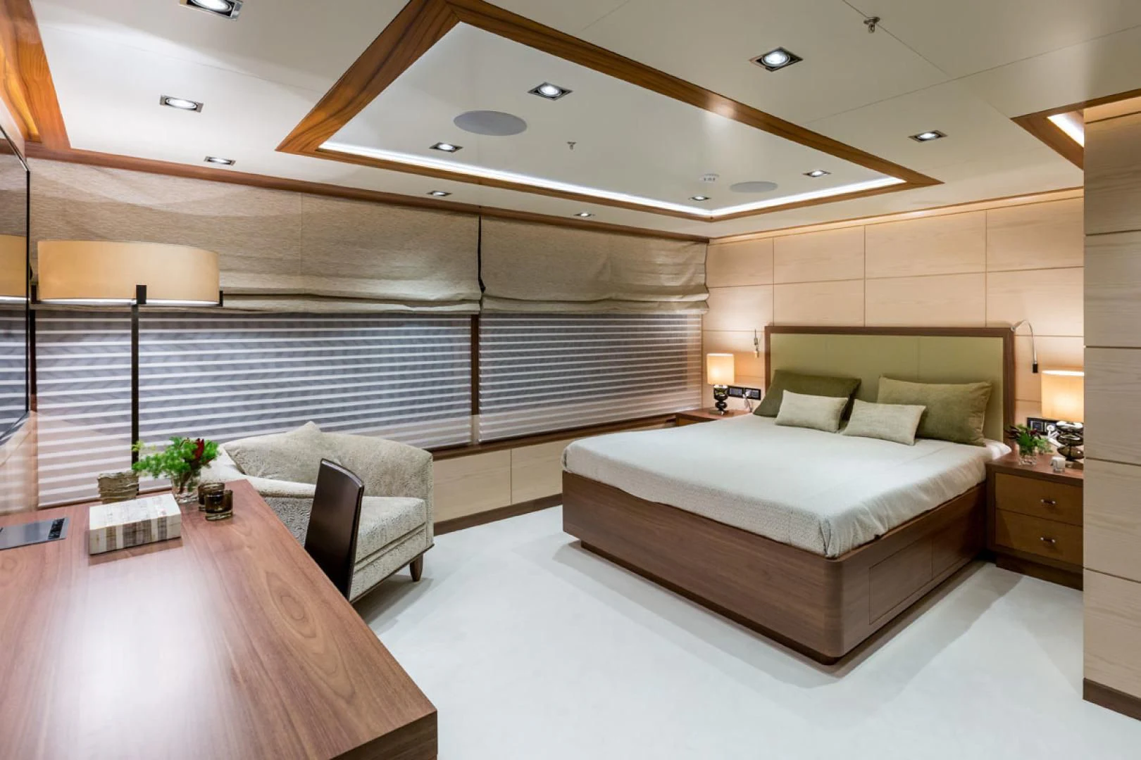 a room with a bed and a chair aboard MAYBE Yacht for Sale
