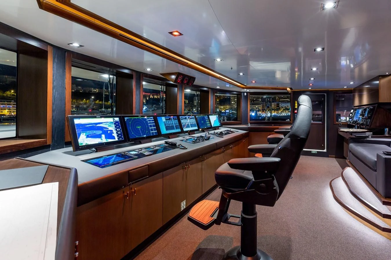 a room with a table and chairs aboard MAYBE Yacht for Sale