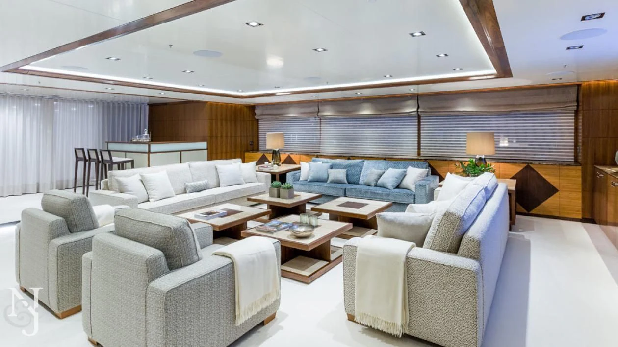 a living room with a couch and a table aboard MAYBE Yacht for Sale