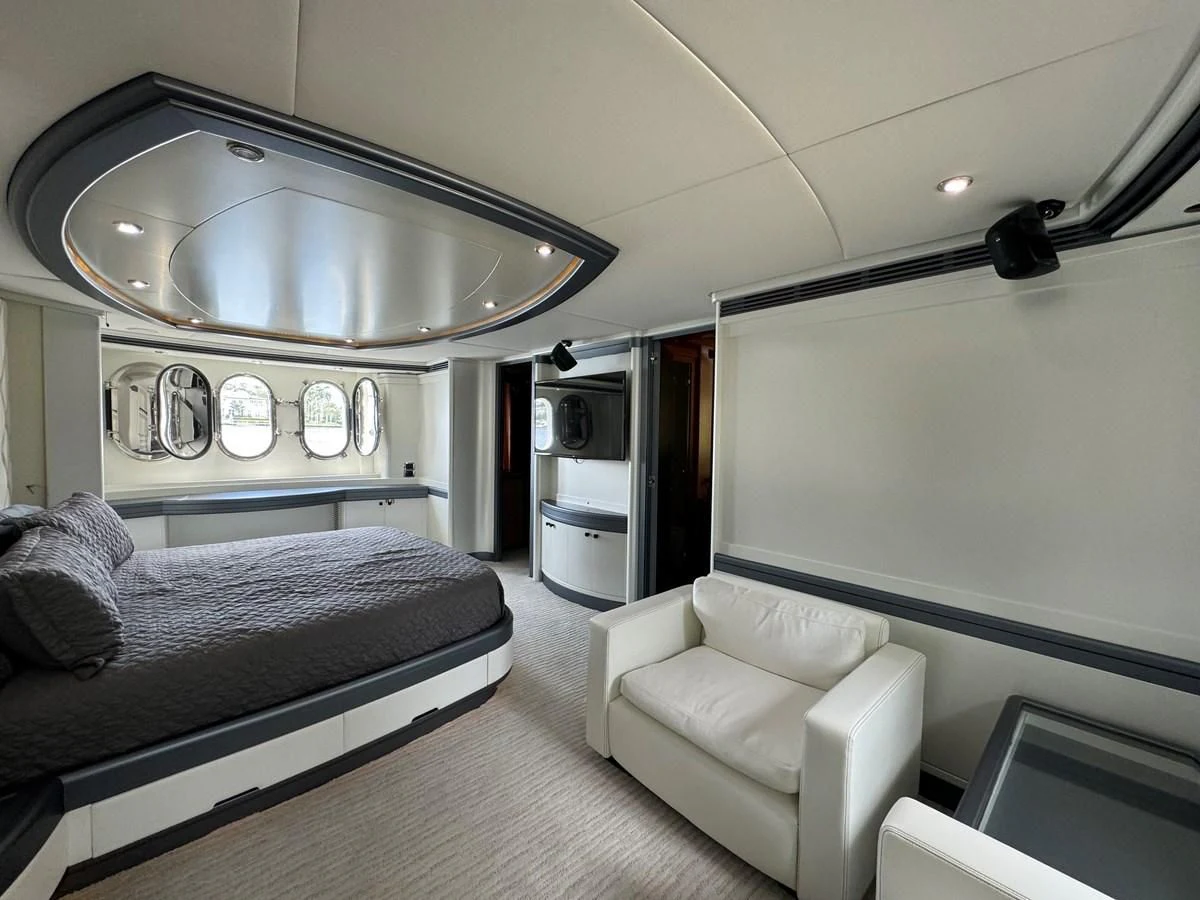 a bedroom with a bed and a couch aboard AZIMUT 100/32 Yacht for Sale