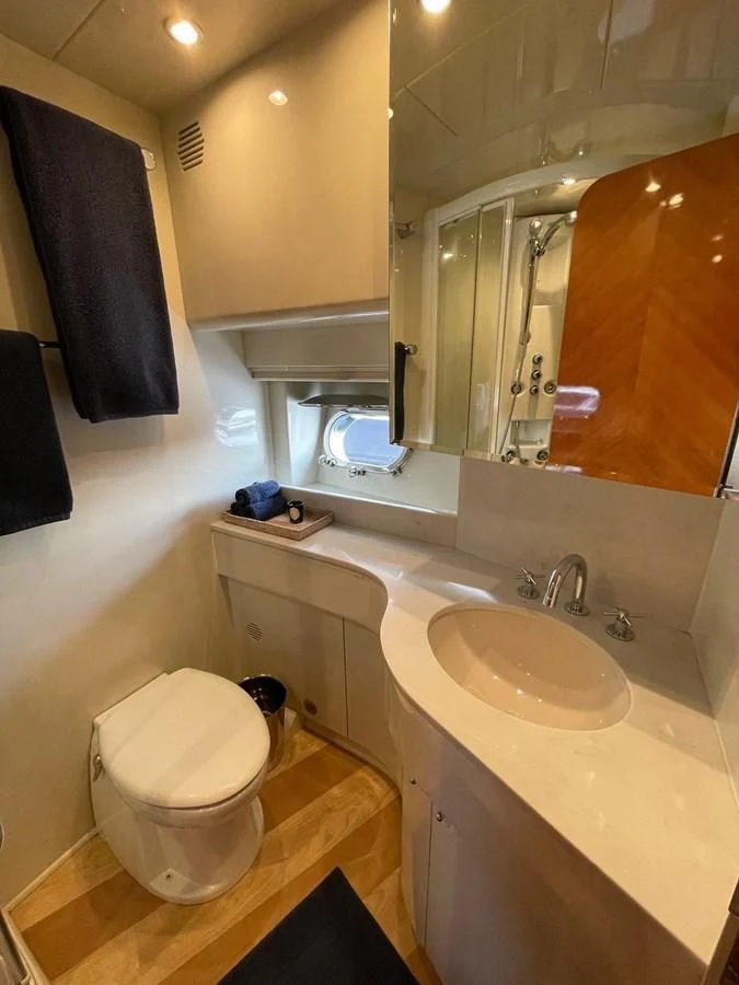a bathroom with a toilet and a sink aboard AZIMUT 100/32 Yacht for Sale