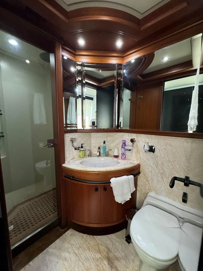 a bathroom with a sink and toilet aboard AZIMUT 100/32 Yacht for Sale