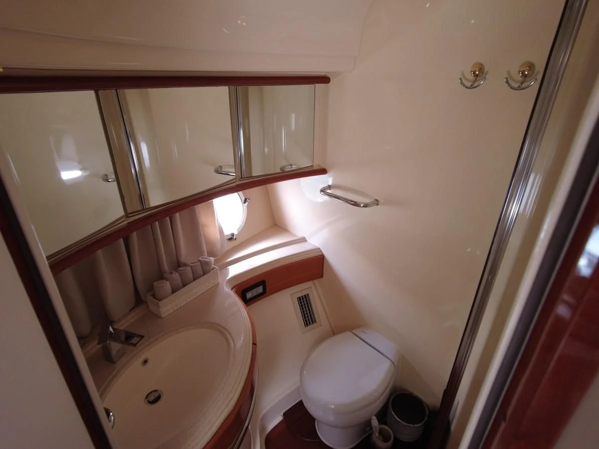 a bathroom with a sink and toilet aboard AZIMUT 100/32 Yacht for Sale