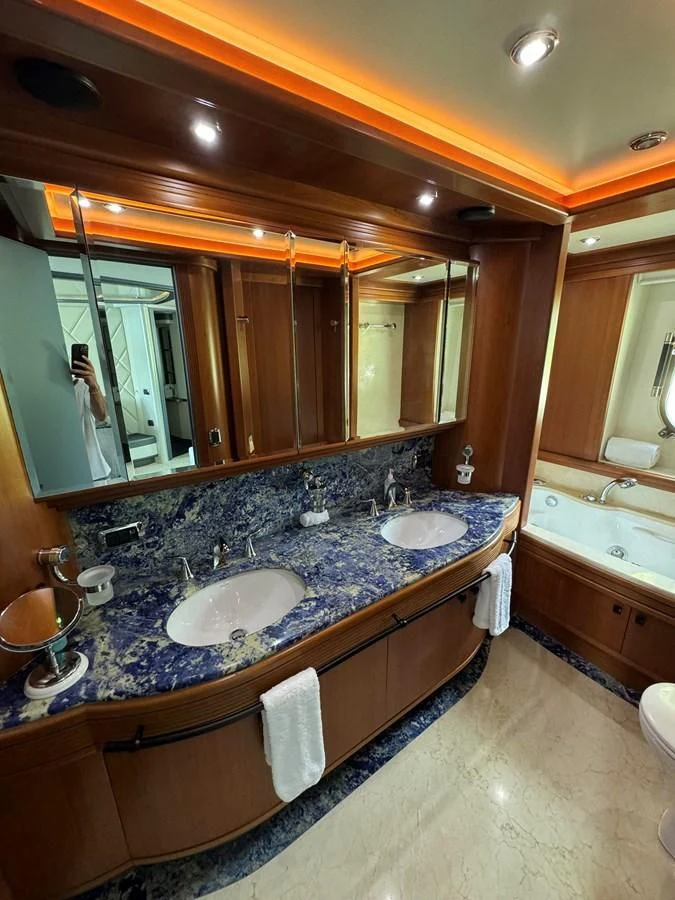 a bathroom with a large mirror aboard AZIMUT 100/32 Yacht for Sale
