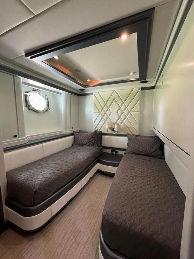 a couch and a table in a room aboard AZIMUT 100/32 Yacht for Sale