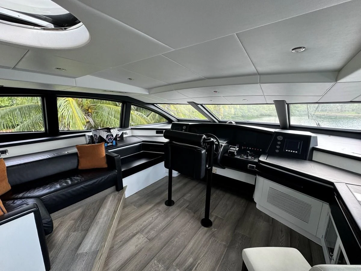 a room with a couch and a table aboard AZIMUT 100/32 Yacht for Sale