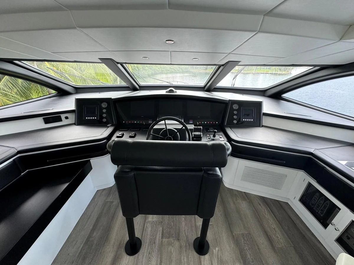 a black chair in a car aboard AZIMUT 100/32 Yacht for Sale