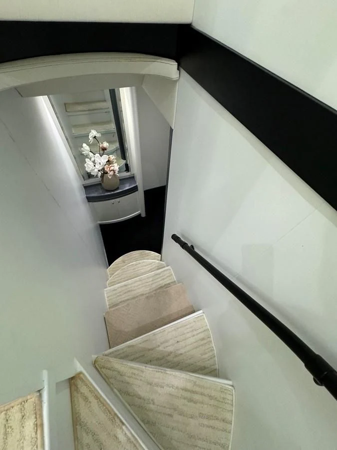 a staircase with a white wall aboard AZIMUT 100/32 Yacht for Sale