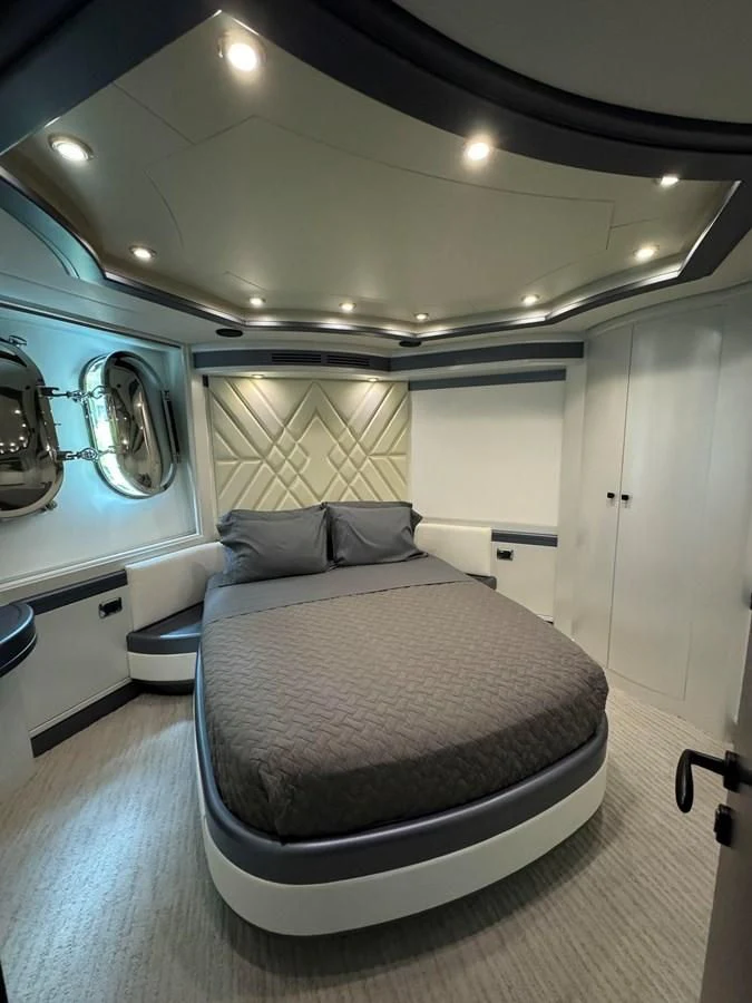 a bed in a room aboard AZIMUT 100/32 Yacht for Sale