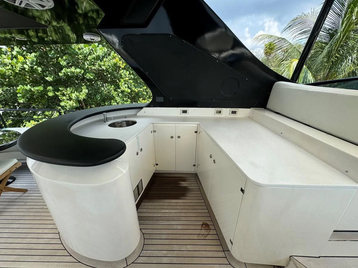 a white toilet with a black seat aboard AZIMUT 100/32 Yacht for Sale