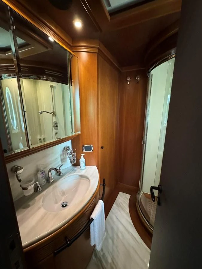 a bathroom with a sink and a mirror aboard AZIMUT 100/32 Yacht for Sale