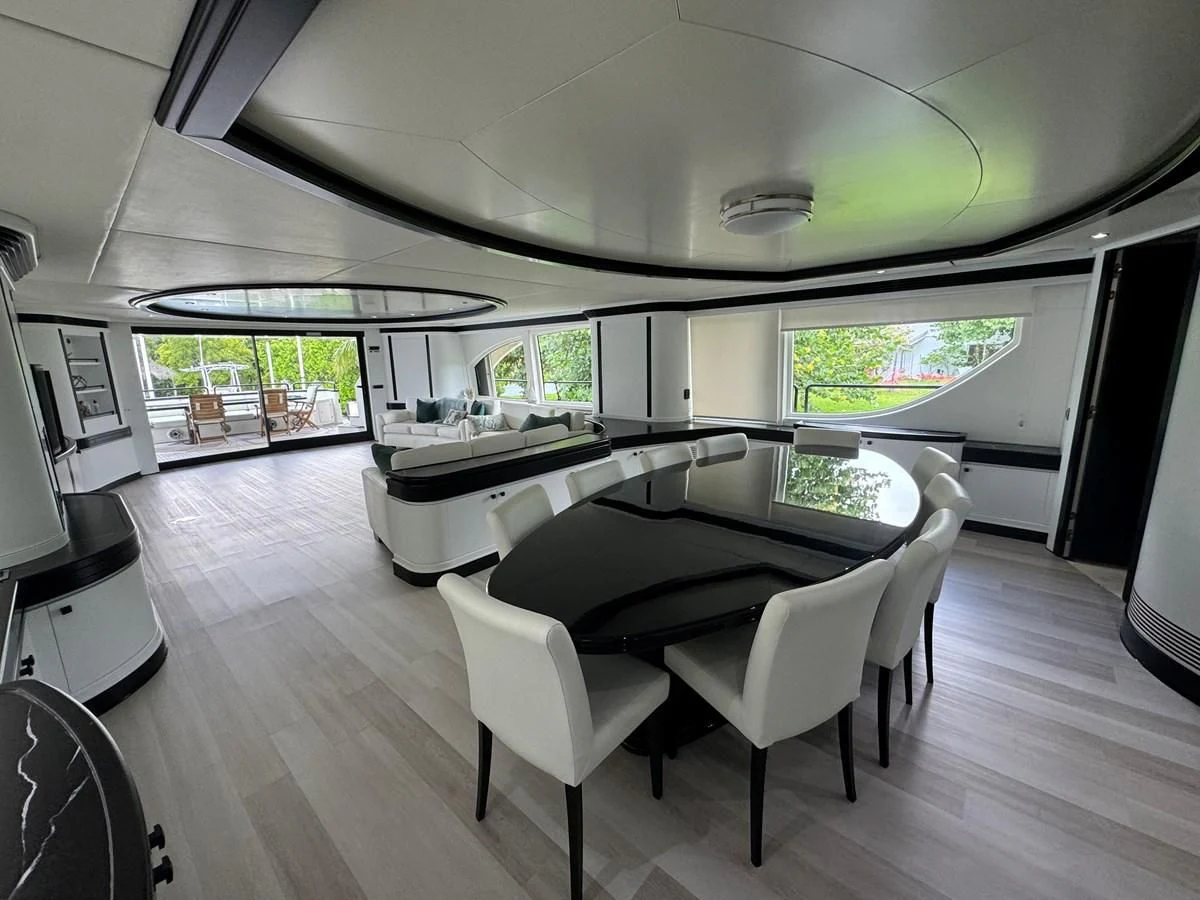 a room with a table and chairs aboard AZIMUT 100/32 Yacht for Sale