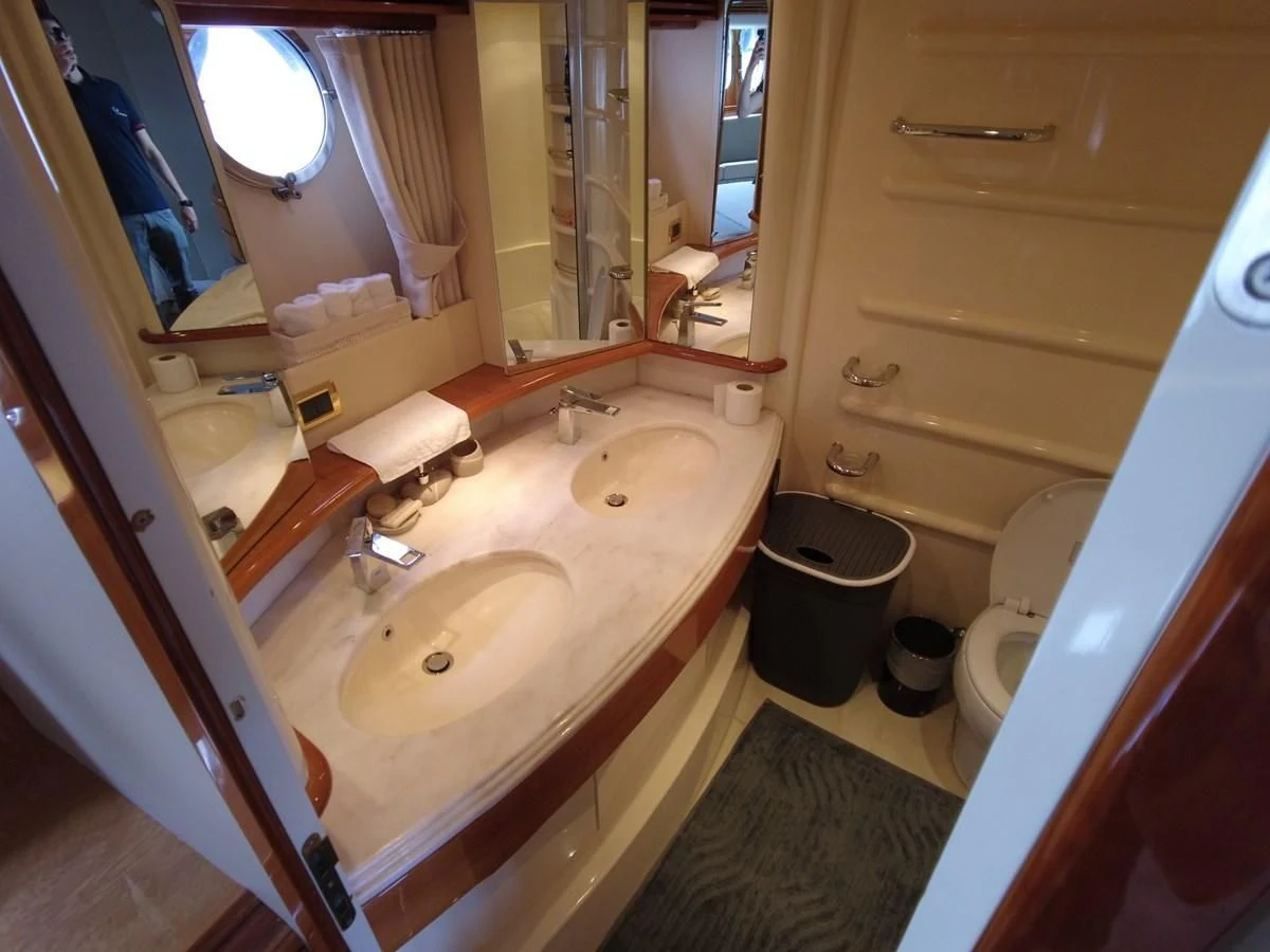 a bathroom with a sink and toilet aboard AZIMUT 100/32 Yacht for Sale