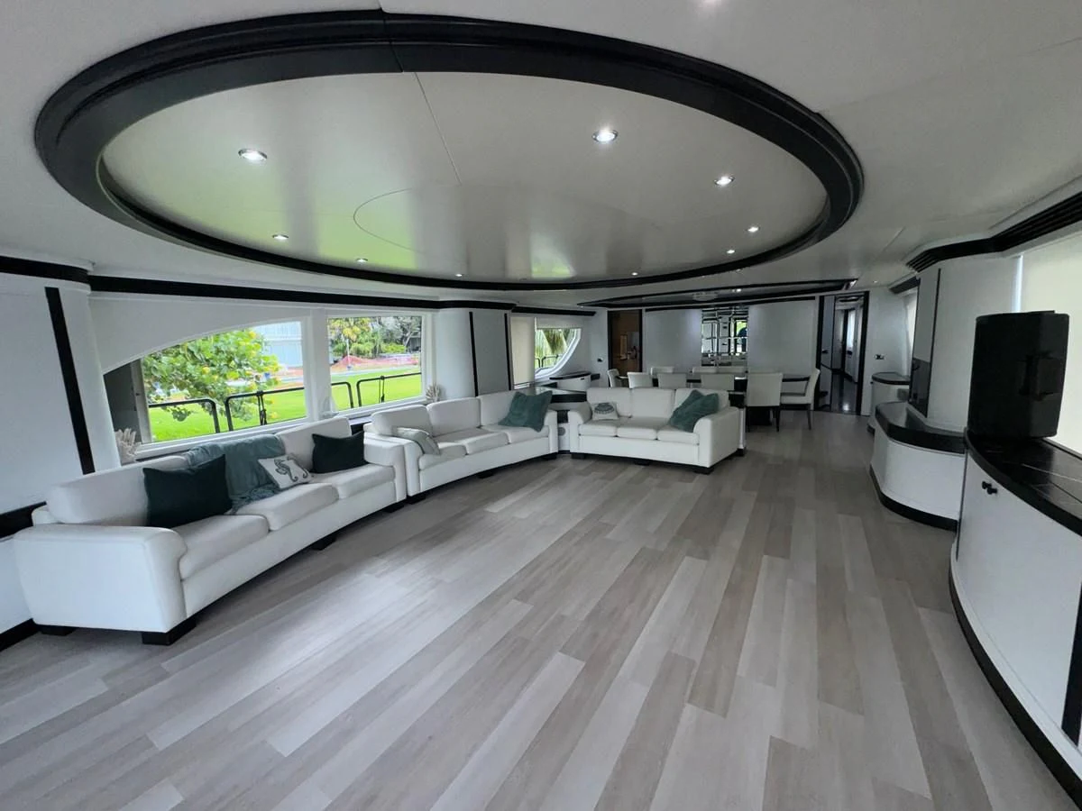 a large living room with a large open window aboard AZIMUT 100/32 Yacht for Sale