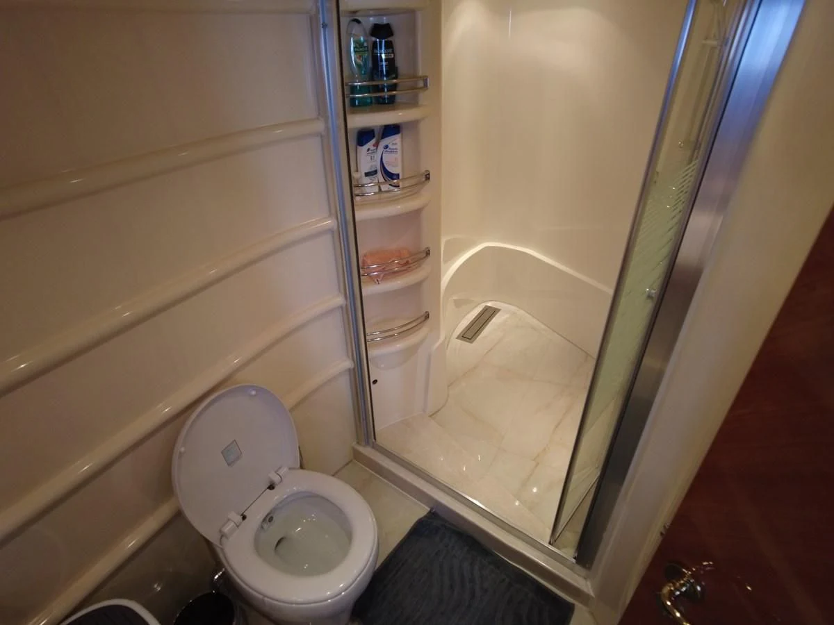 a bathroom with a toilet and a shower aboard AZIMUT 100/32 Yacht for Sale