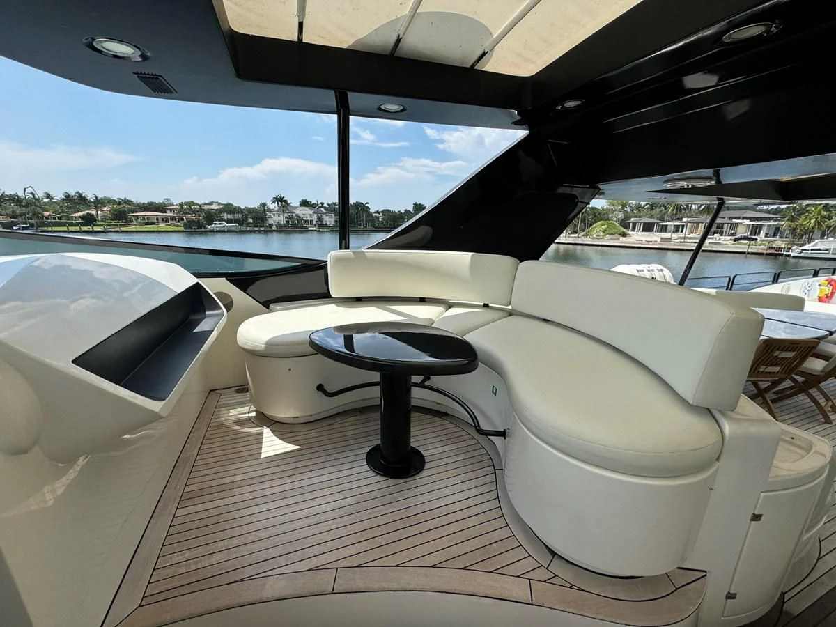 a white lounge chair on a deck aboard AZIMUT 100/32 Yacht for Sale