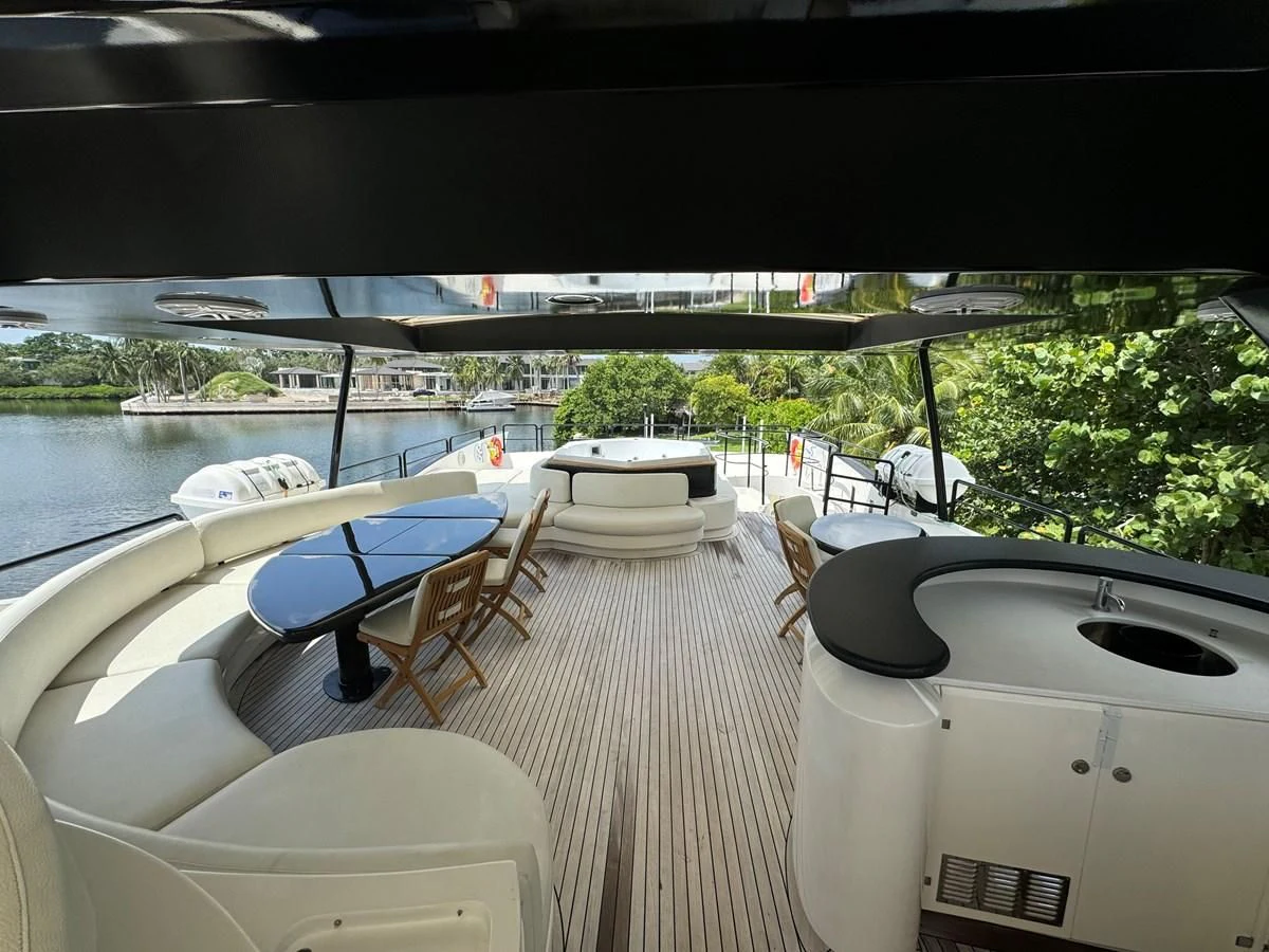 a room with a table and chairs aboard AZIMUT 100/32 Yacht for Sale