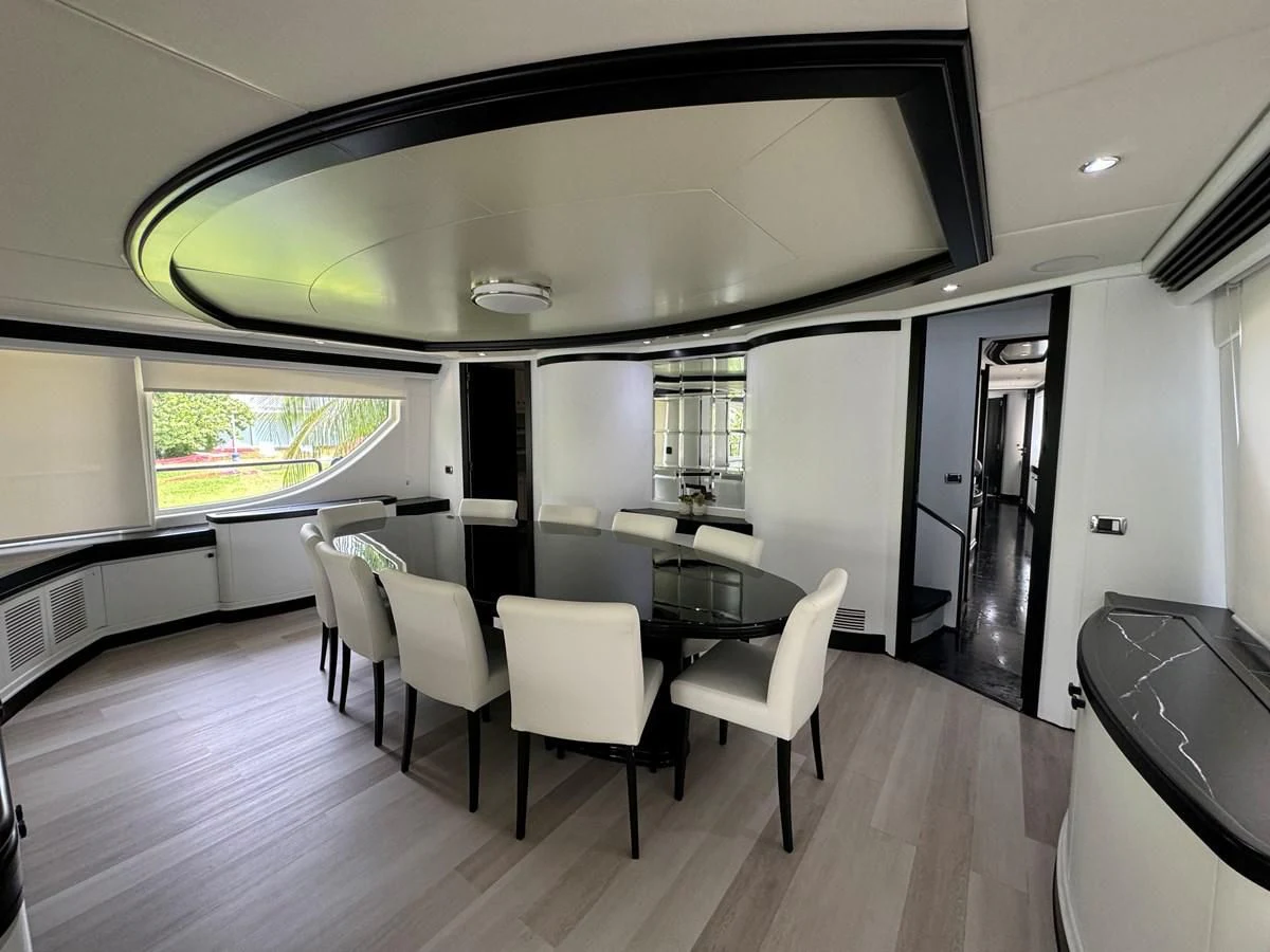 a large room with a table and chairs aboard AZIMUT 100/32 Yacht for Sale
