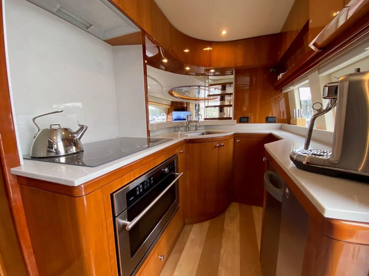 a kitchen with a sink and a microwave aboard AZIMUT 100/32 Yacht for Sale