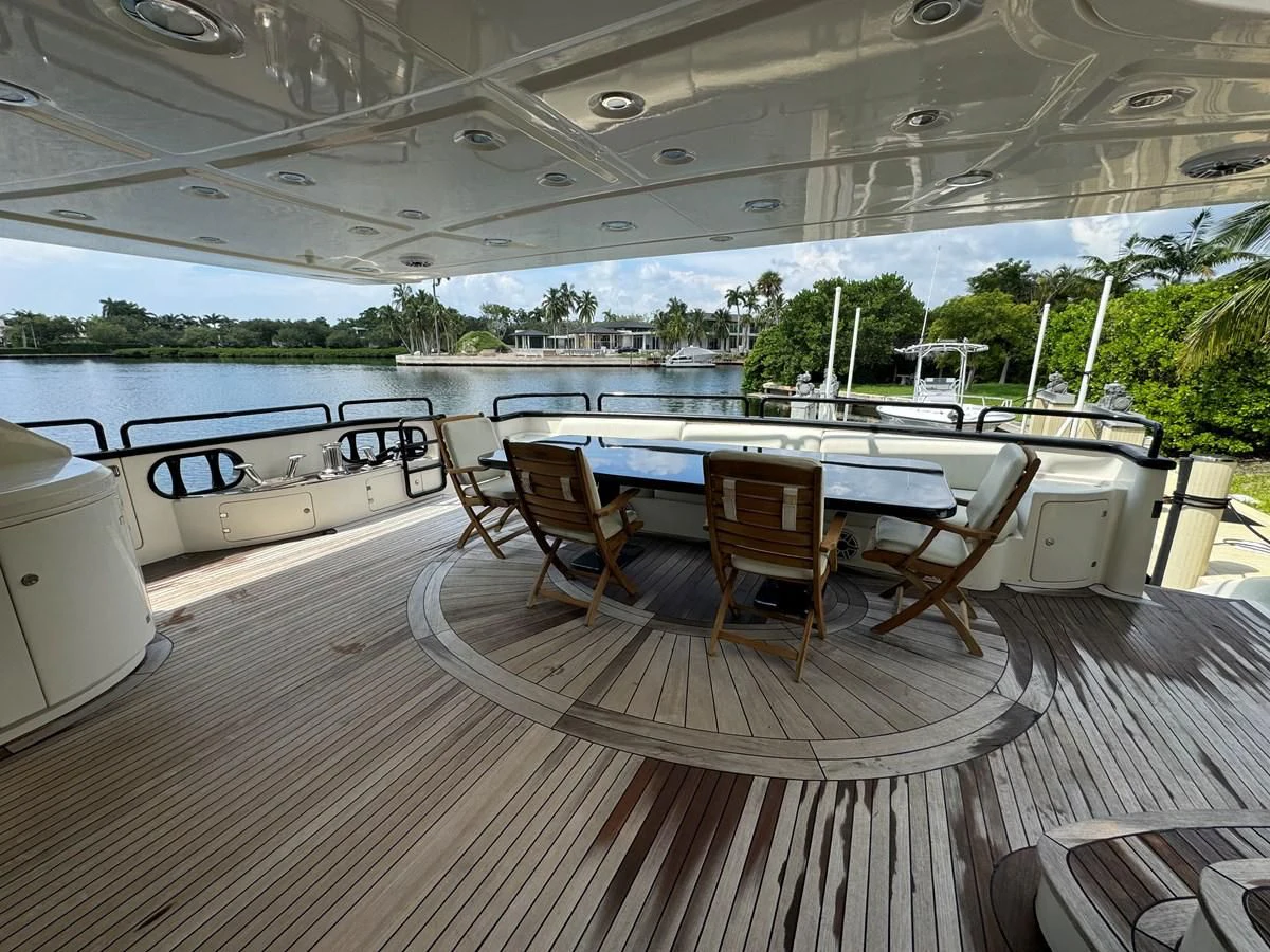 a large patio with a table and chairs aboard AZIMUT 100/32 Yacht for Sale