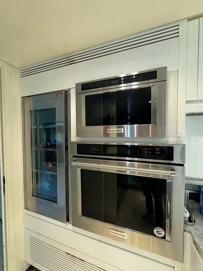 a kitchen with a microwave oven aboard AZIMUT 100/32 Yacht for Sale