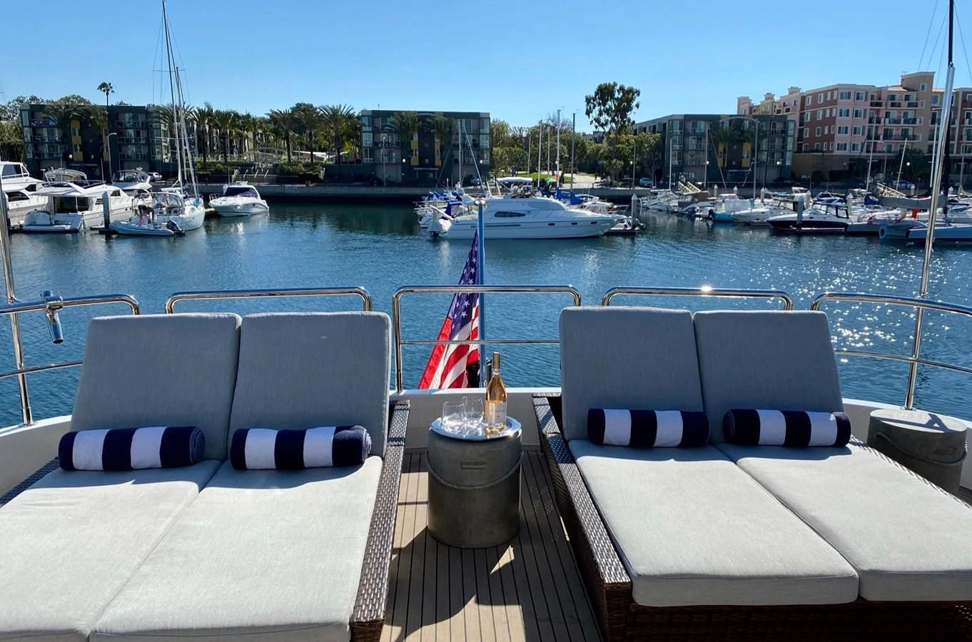 a boat dock with lounge chairs aboard AZIMUT 100/32 Yacht for Sale
